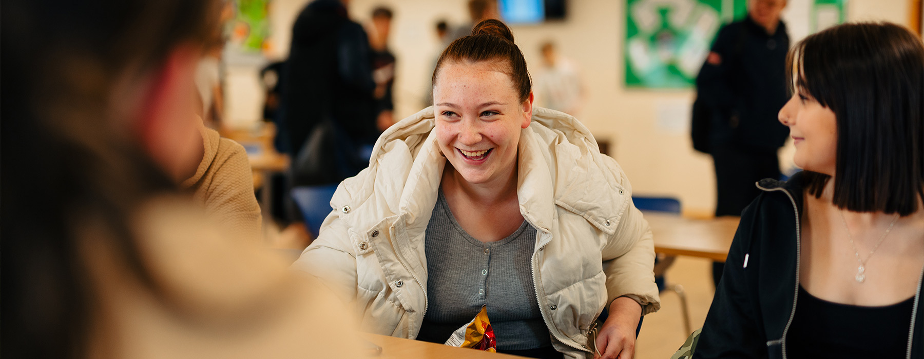 Riseholme College students smiling in canteen
