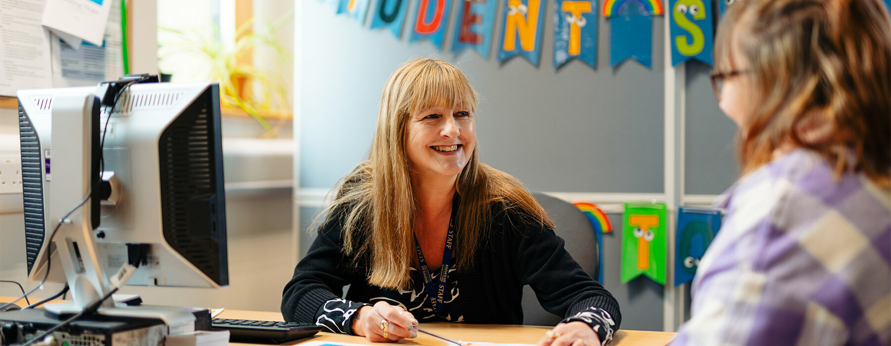 Student services similing at student