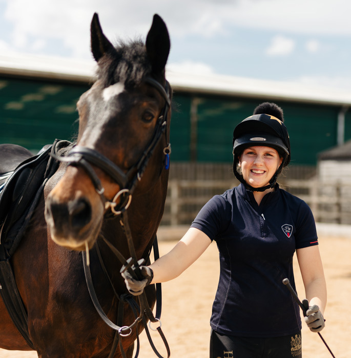 Equine students with horse smiling