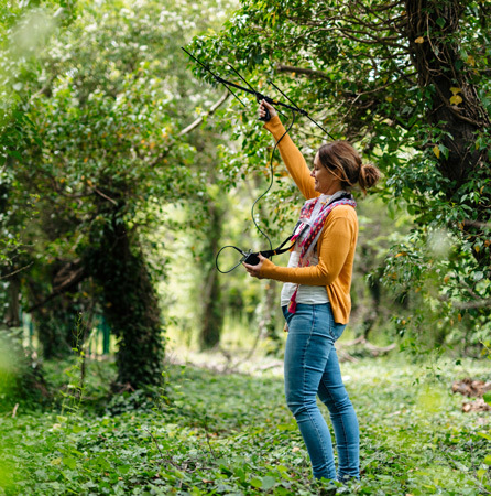 Student in woodland at Riseholme College thumb